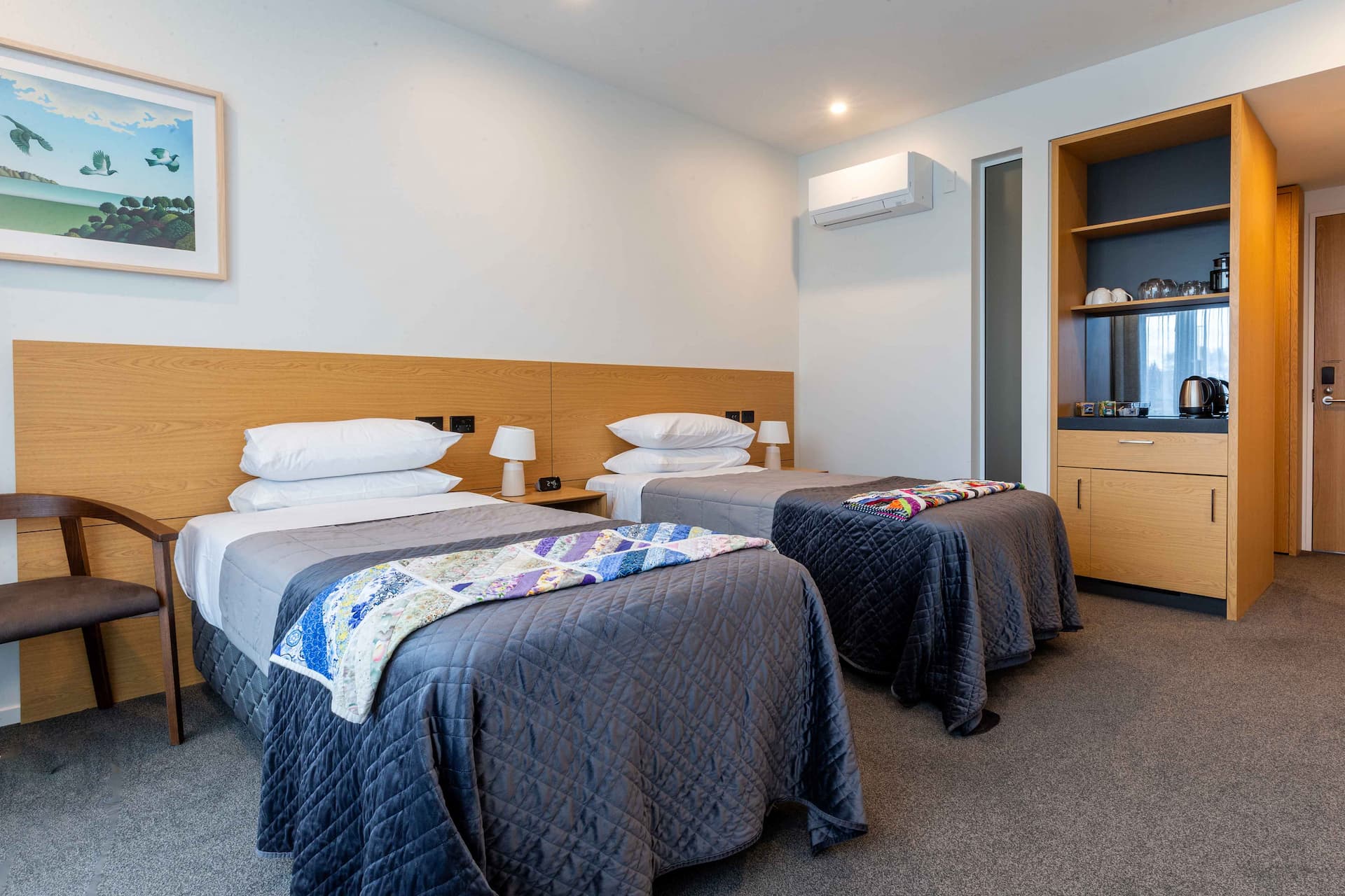 Twin bedroom and minibar joinery at Cancer Care accommodation