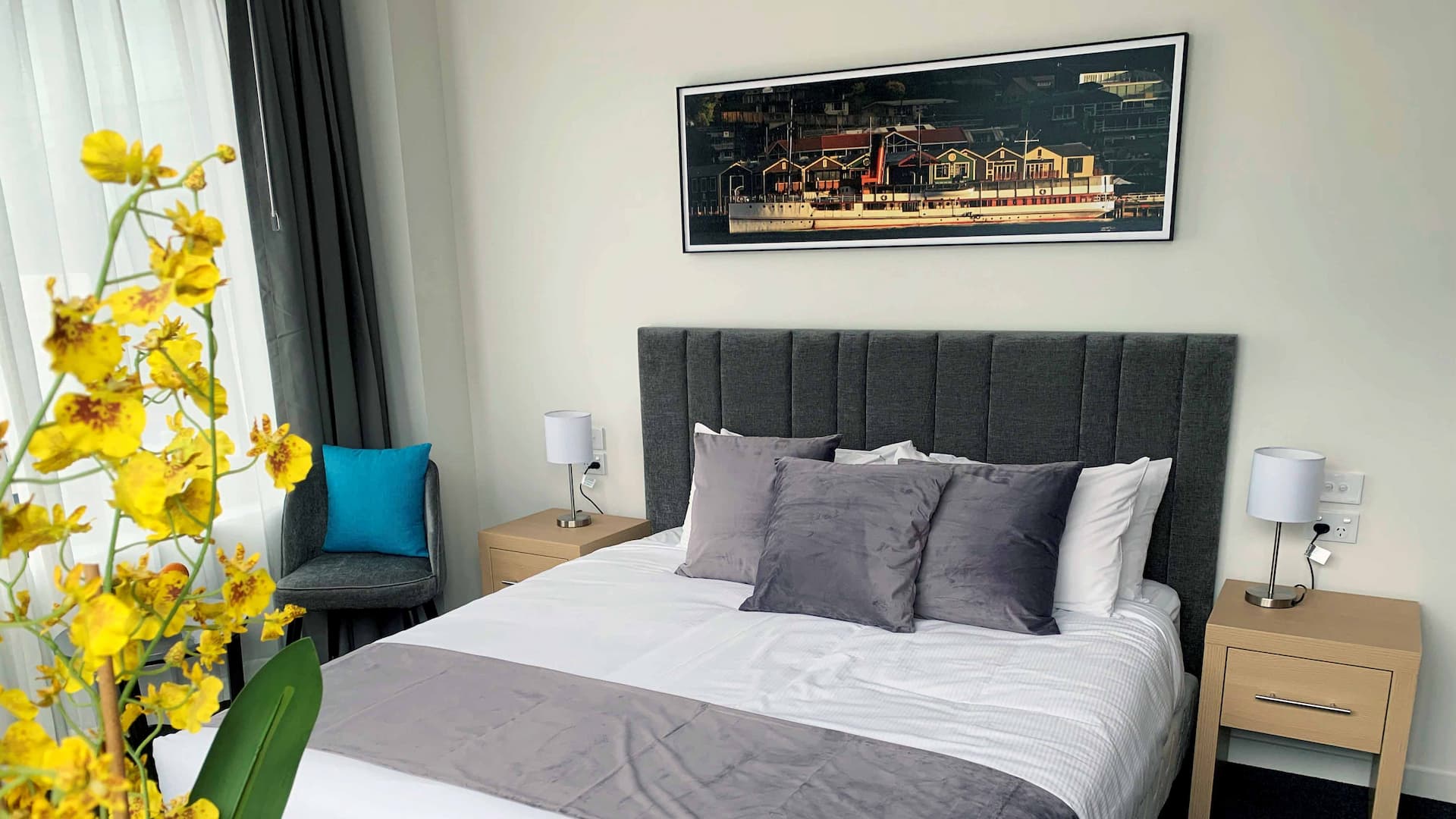 Guest room headboard and New Zealand artwork at Christchurch City Hotel