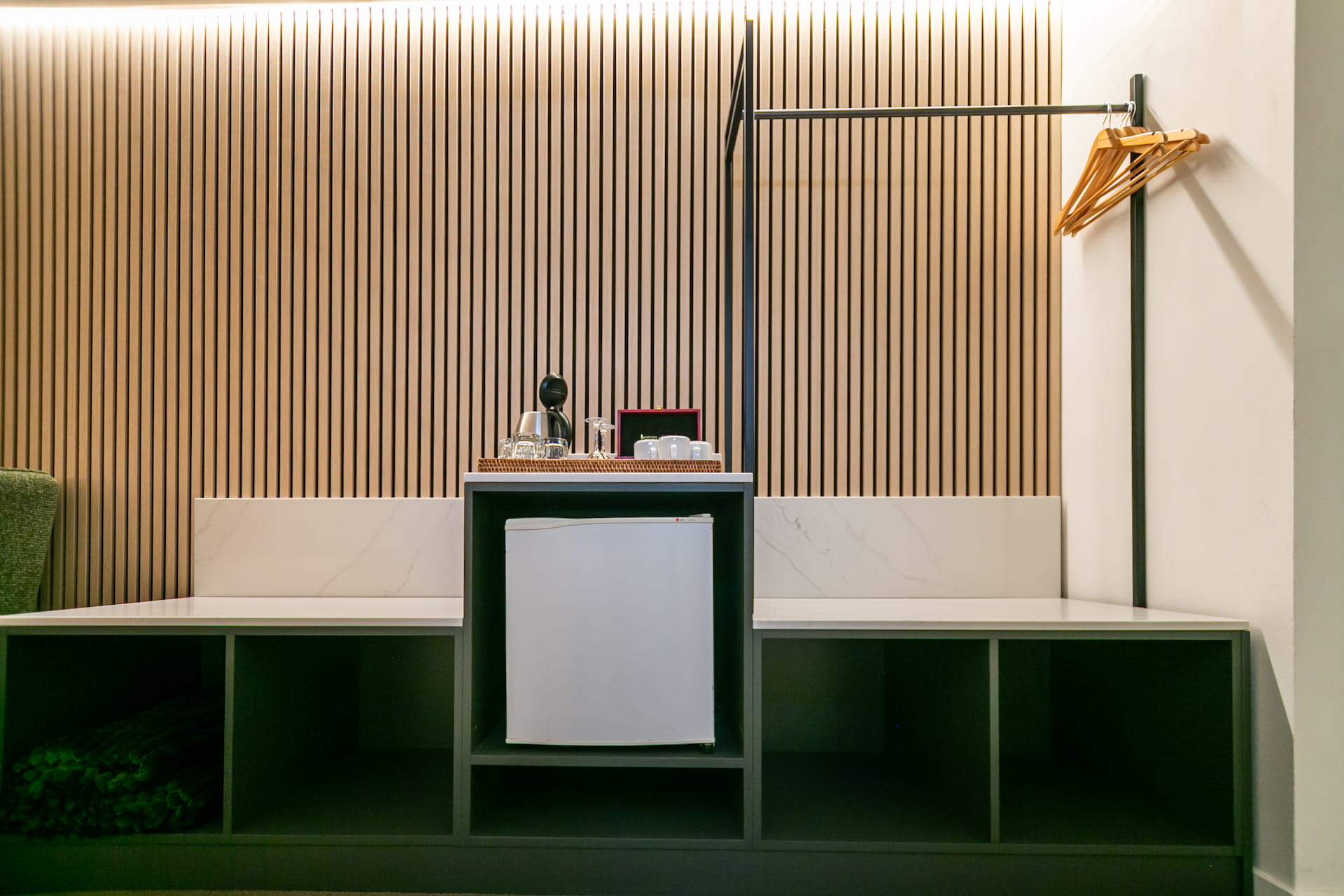 Minibar and luggage storage joinery at The Godley Hotel