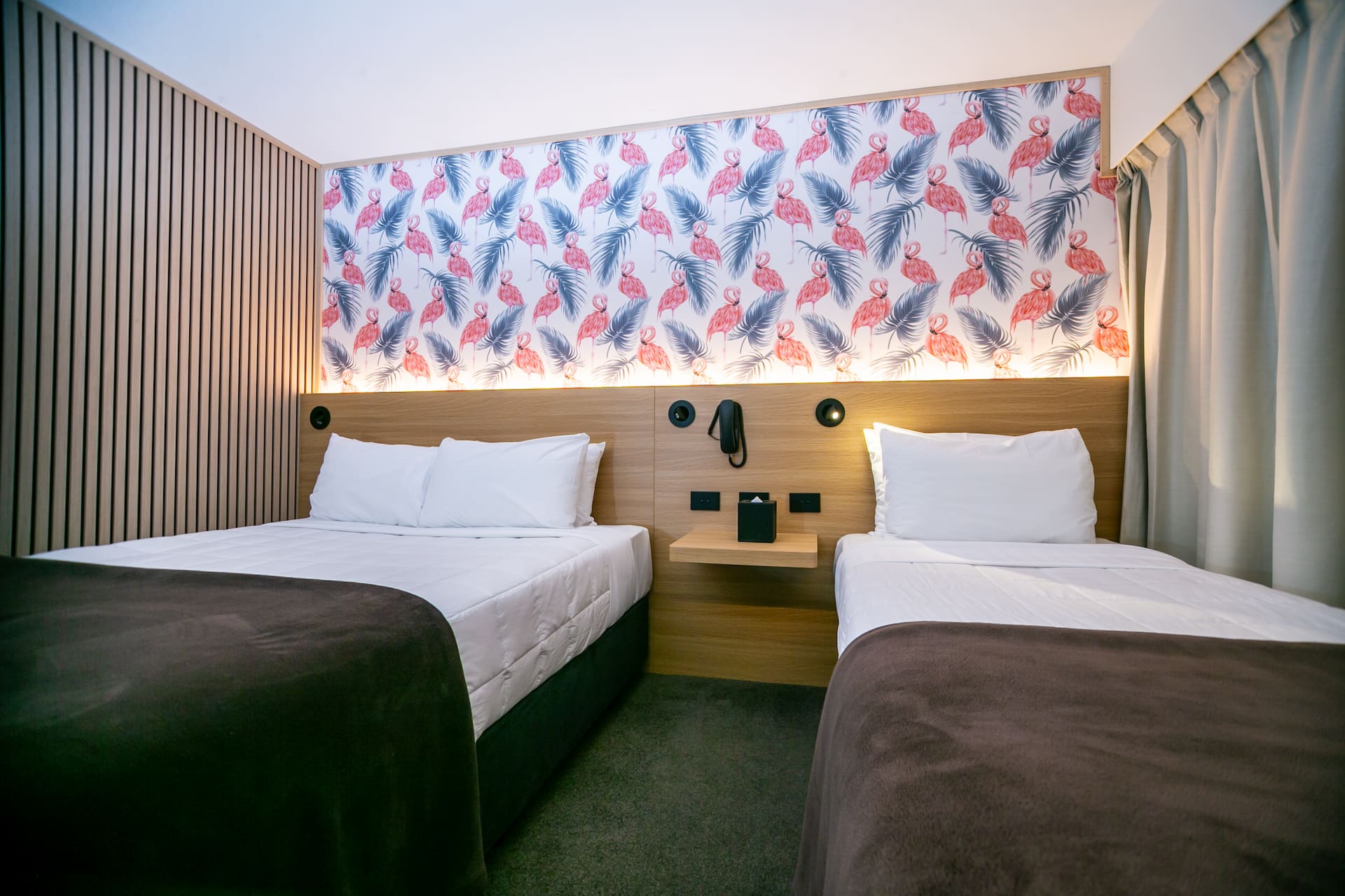 Guest room beds and bedside joinery at The Godley Hotel