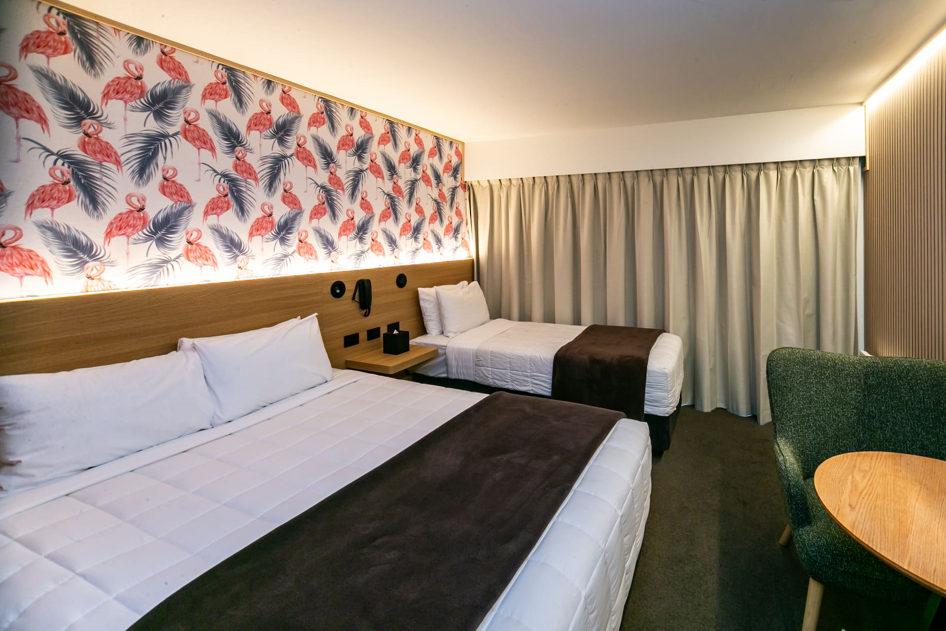 Family guest room with custom headboard at The Godley Hotel