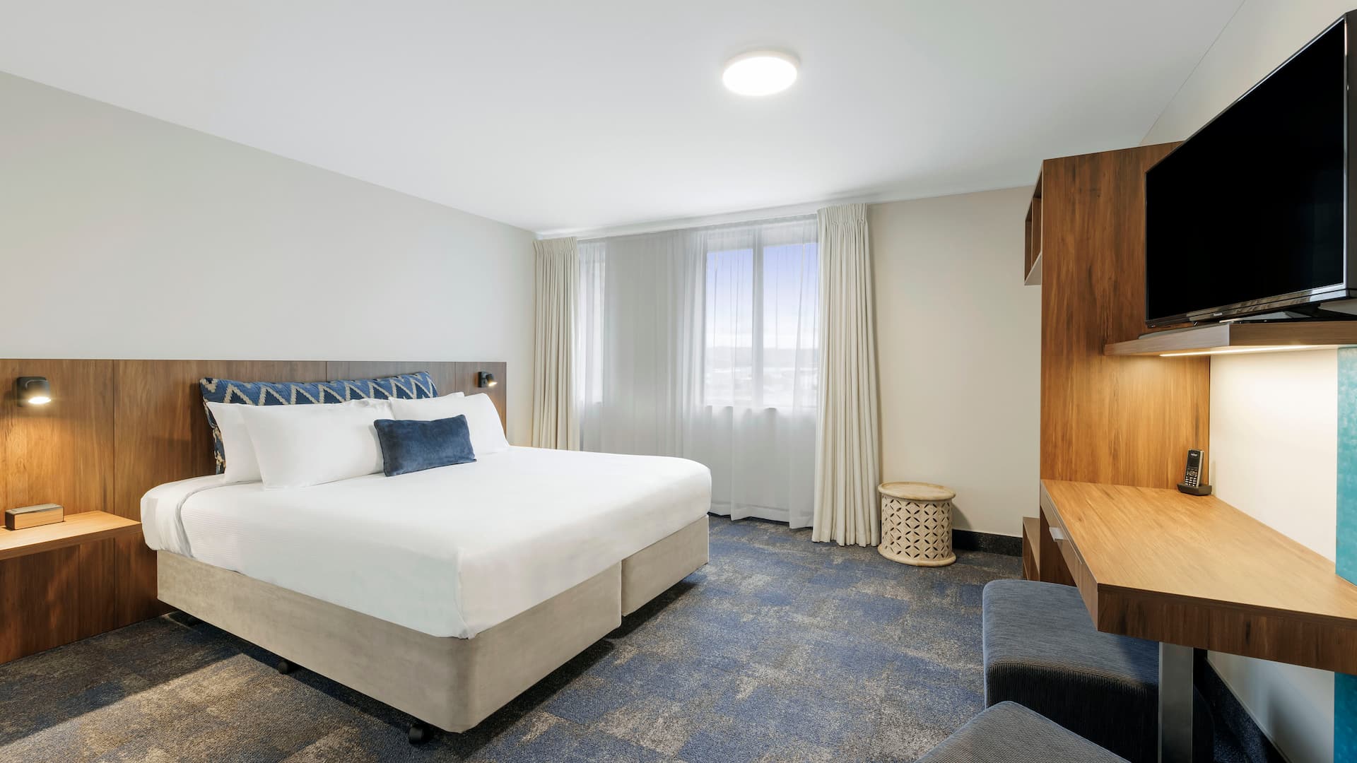 Guest room bed and desk joinery at Jet Park Hotel Rotorua